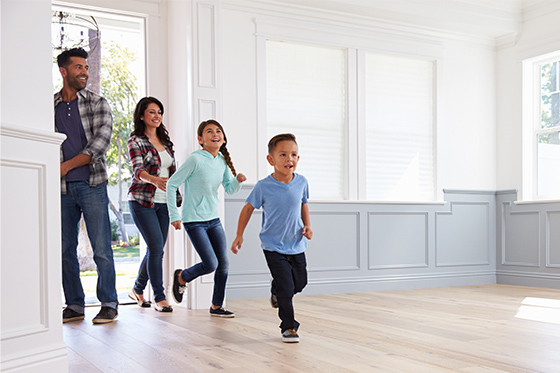 family entering a new home